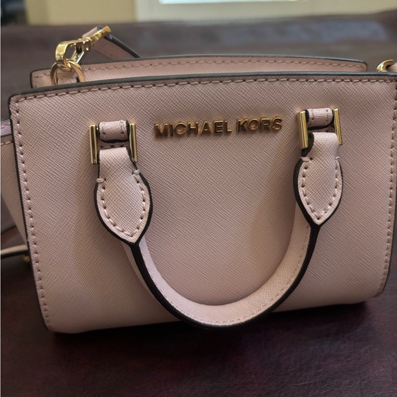 Michael Kors Handbags - Michael Kors light pink Mini Bag with straps brand new